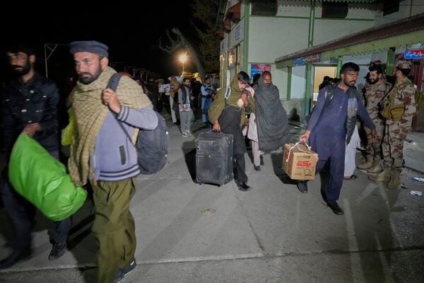 Passengers rescued by security forces from a passenger train attacked by insurgents arrive at a railway station in Much, Pakistan's southwestern Balochistan province, Thursday March 13, 2025. (AP Photo/Anjum Naveed)