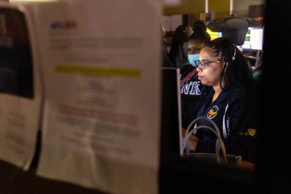 A call taker works at Atlanta’s 911 center on Thursday, July 6, 2023. (Arvin Temkar / arvin.temkar@ajc.com)