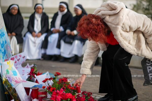 Nuns pray for Pope Francis in front of the Agostino Gemelli Polyclinic, in Rome, Thursday, Feb. 27, 2025, where Pope Francis is hospitalized since Friday, Feb. 14. (AP Photo/Andrew Medichini)