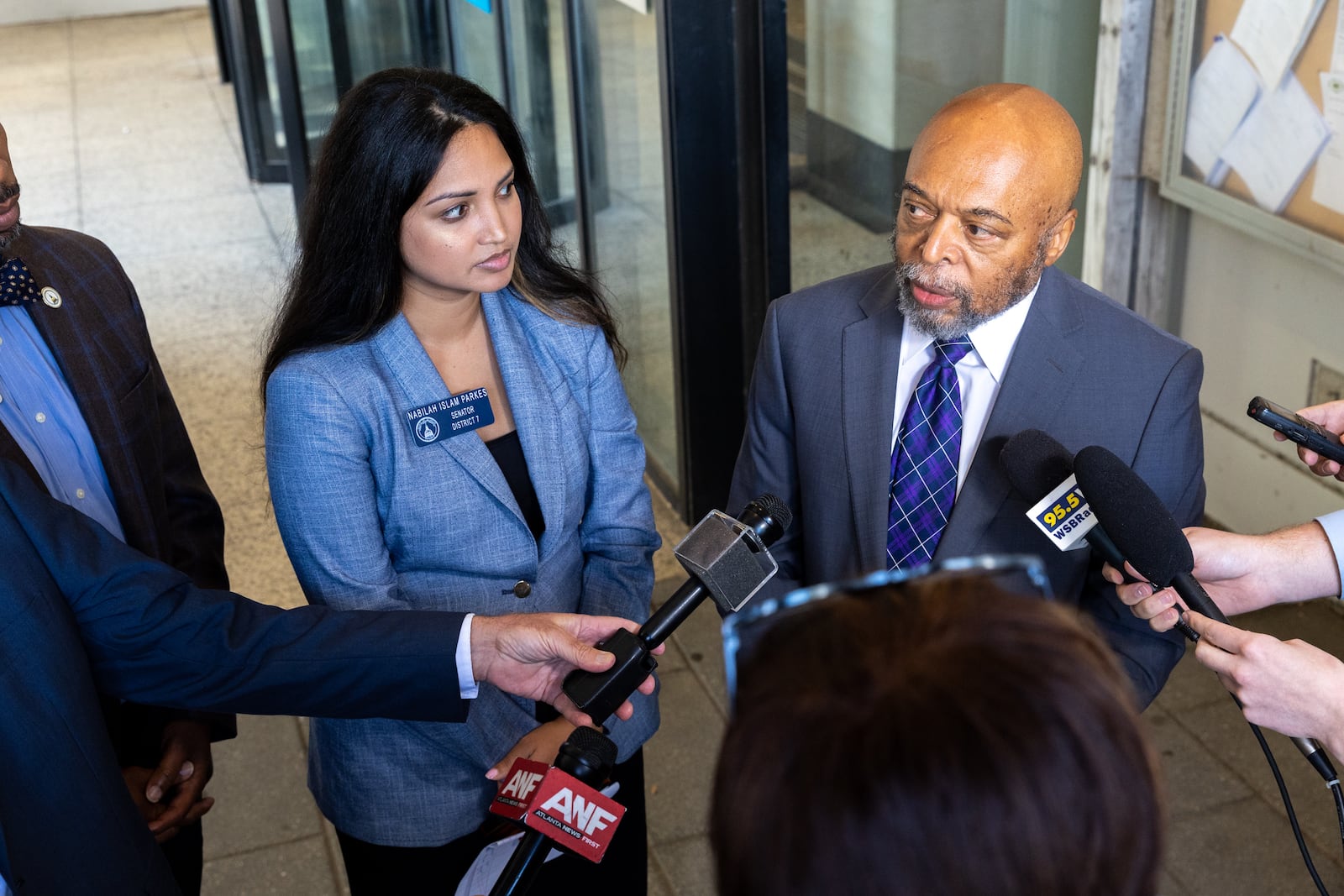 Democratic state Sen. Nabilah Islam Parkes and her attorney, Wayne Kendall, speak to the news media after a Fulton County judge dismissed a lawsuit by Democrats who wanted the governor to investigate the State Elections Board.