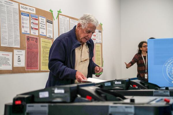 Hartley Falbaum of Loganville casts his ballot during early voting for the presidential primary at the Gwinnett County Voter Registrations and Elections office building in Lawrenceville, Monday, March 2, 2020. (Alyssa Pointer/AJC)