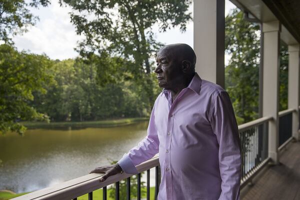 Former Coke senior executive Carl Ware looks over a lake on his residential property in Newnan. Ware recently wrote a book, “Portrait of an American Businessman: One Generation from Cotton Field to Boardroom,” detailing his life and his time at the Coca-Cola Company. (Alyssa Pointer/alyssa.pointer@ajc.com)