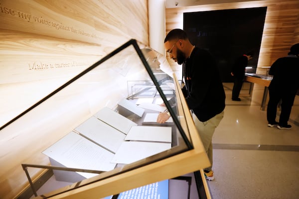 Lance Wheeler, Director of Exhibitions at the National Center for Civil and Human Rights museum in Atlanta,  places pieces for the new exhibit "Now Is the Time: Remembering the Legacy of the March on Washington for Jobs and Freedom," on Thursday, 11, 2023. The show opened ahead of the Martin Luther King Jr. holiday celebrations.   Miguel Martinez / miguel.martinezjimenez@ajc.com