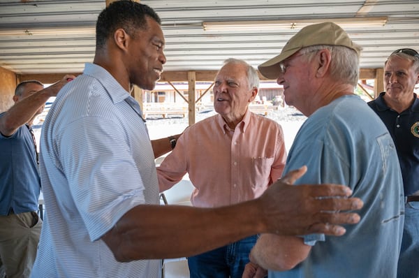  Republican Senate nominee Herschel Walker (left) greets former Gov. Nathan Deal (center) and Ron Hooper, chairman of Banks County Republican Party, after a roundtable with local farmers at Jaemor Farms in Alto on Tuesday, September 13, 2022.(Hyosub Shin / Hyosub.Shin@ajc.com)