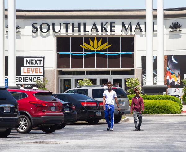 A steady stream of people enter the Southlake Mall in Morrow on Friday, May 1, 2020. STEVE SCHAEFER / SPECIAL TO THE AJC