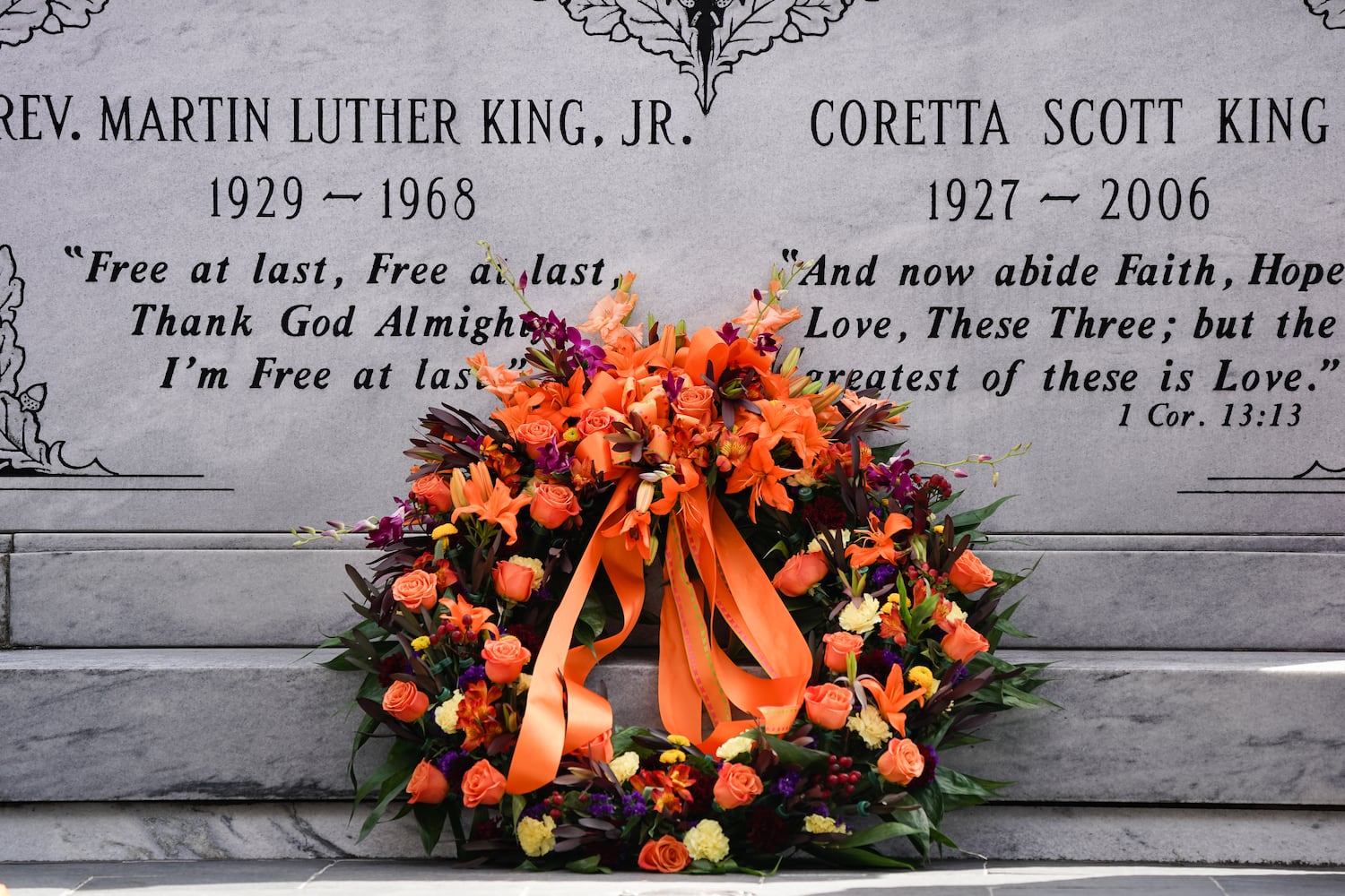 A wreath is seen in front of the tomb of Dr. Martin Luther King Jr. and Coretta Scott King as members of the King family look on at The King Center on the 54th anniversary of the assassination of Dr. Martin Luther King Jr., on Monday, April 4, 2022, in Atlanta. (Elijah Nouvelage/Special to the Atlanta Journal-Constitution)