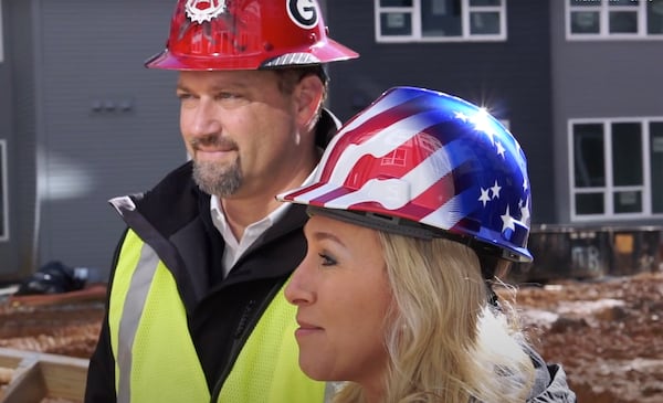 Marjorie Taylor Green and her husband, Perry, seen here in a campaign ad, both graduated from the UGA business school in 1996. The company's website over the years has emphasized his role leading the company. She said they've been running the company together since purchasing it from her father in 2002.