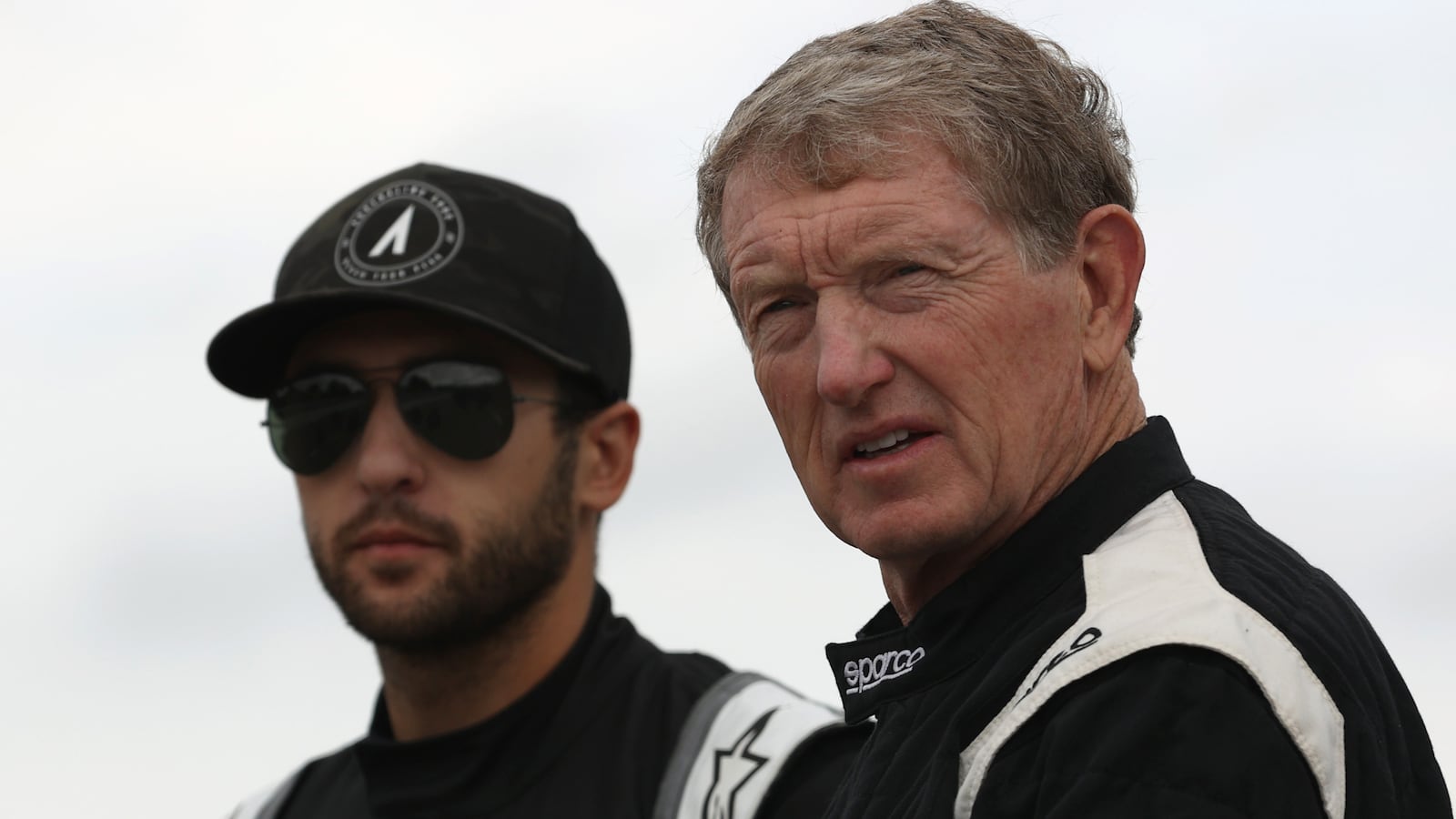 Chase Elliott (background) and Bill Elliott look on during practice prior to the Camping World Superstar Racing Experience event Saturday, July 17, 2021, at Nashville Fairgrounds Speedway in Nashville, Tenn. (Mike Arning/True Speed PR)