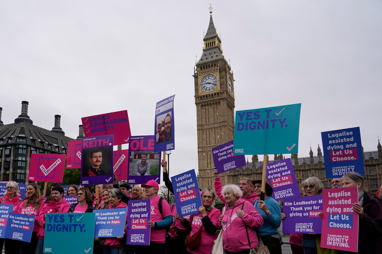 A small demonstration by people advocating assisted dying hold a protest outside the Hoses of Parliament as a bill to legalise assisted dying is to be put before lawmakers in London, England, Wednesday, Oct. 16, 2024. (AP Photo/Alberto Pezzali)