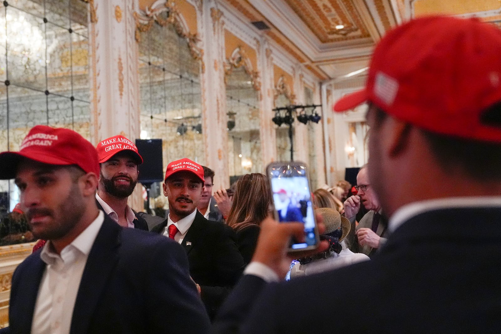 Supporters arrive before Republican presidential nominee former President Donald Trump speaks during a news conference at his Mar-a-Lago estate, Tuesday, Oct. 29, 2024, in Palm Beach, Fla. (AP Photo/Julia Demaree Nikhinson)