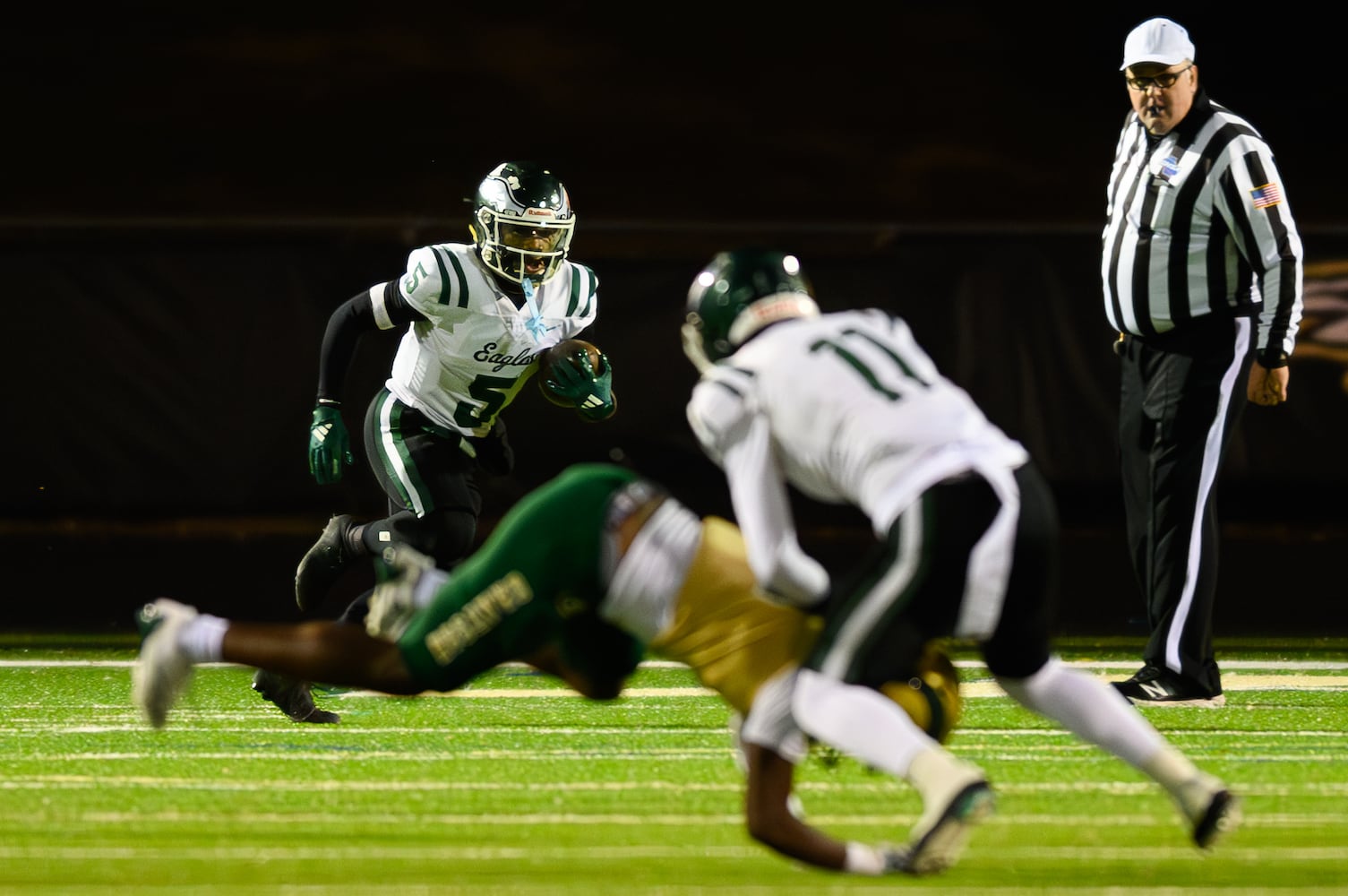 Collins Hill's Cameron Jones runs the ball against Grayson. (Jamie Spaar for the Atlanta Journal Constitution)