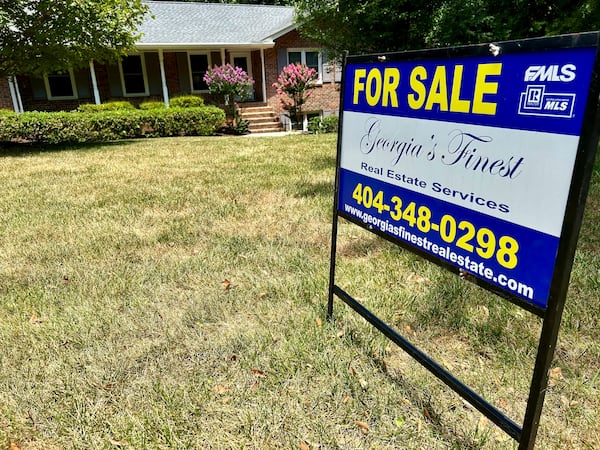 WIth many Atlantans heading for vacations -- and interest rates still high -- the housing market cooled as summer was arriving. Here, a Dunwoody home listed for sale in late June. J. Scott Trubey/scott.trubey@ajc.com.