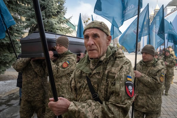 Servicemen carry the coffin of Ukrainian soldier Vasyl Ratushnyy, 28, during the funeral ceremony in St. Michael Cathedral in Kyiv, Ukraine, Wednesday, March 5, 2025. (AP Photo/Efrem Lukatsky)