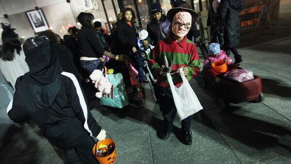 Kids dressed in their Halloween costumes get ready to trick or treat.  