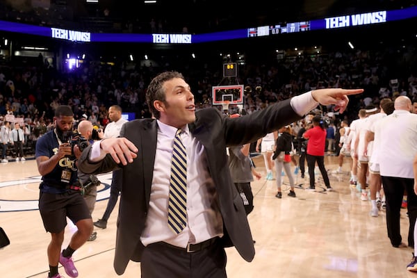 Georgia Tech Yellow Jackets head coach Josh Pastner celebrates their 79-77 win against the Georgia Bulldogs at McCamish Pavilion, Tuesday, December 6, 2022, in Atlanta. (Jason Getz / Jason.Getz@ajc.com)