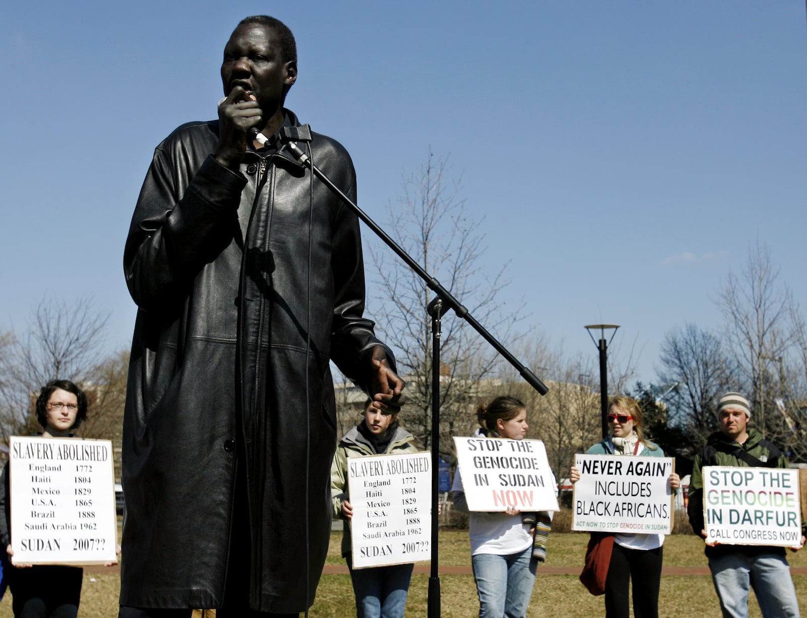 Former NBA star Manute Bol speaks at a rally at the Independence Visitor Center in 2006 as part of the Philadelphia stop of the Sudan Freedom Walk, a 300-mile march from New York to Washington. Bol played 10 seasons in the NBA and later worked with Sudan Sunrise, a humanitarian group that promotes reconciliation in Sudan. (AP Photo/Matt Rourke)