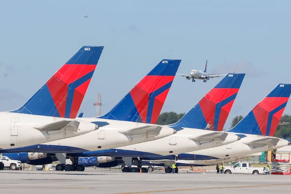 A Delta airplanes are parked as other airplane approach to the runaway at Hartsfield-Jackson Atlanta International Airport on Wednesday, May 22, 2024.
Miguel Martinez /miguel.martinezjimenez@ajc.com