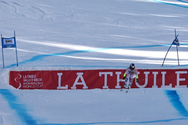 Germany's Emma Aicher speeds down the course of an alpine ski, women's World Cup super G race, in La Thuile, Italy, Thursday, March 13, 2025. (AP Photo/Marco Trovati)