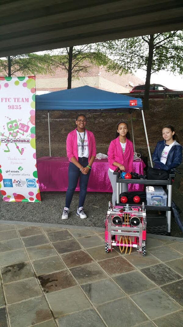 RoboChicks educate the public with their robotic designs. Talking about Maker Faire Atlanta, Madison Kenney (center), 14, said, “There is a lot of variety in what you can make. It just depends on if you are creating for fun or to solve a problem.” CONTRIBUTED BY LEW LEFTON