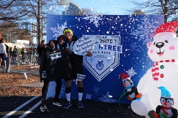 Runners who completed the race took pictures while an artificial snowblower billowed out flakes. A sign sums up the race: "It's like Peachtree ... but backwards and cold." Every participating runner received an Adidas finisher's hoodie.