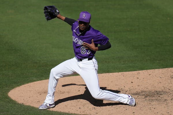 Colorado Rockies pitcher Jefry Yan celebrates a strikeout against Seattle Mariners Jacob Nottingham during the seventh inning of a spring training baseball game, Sunday, March 2, 2025, in Scottsdale, Ariz. (AP Photo/Ross D. Franklin)