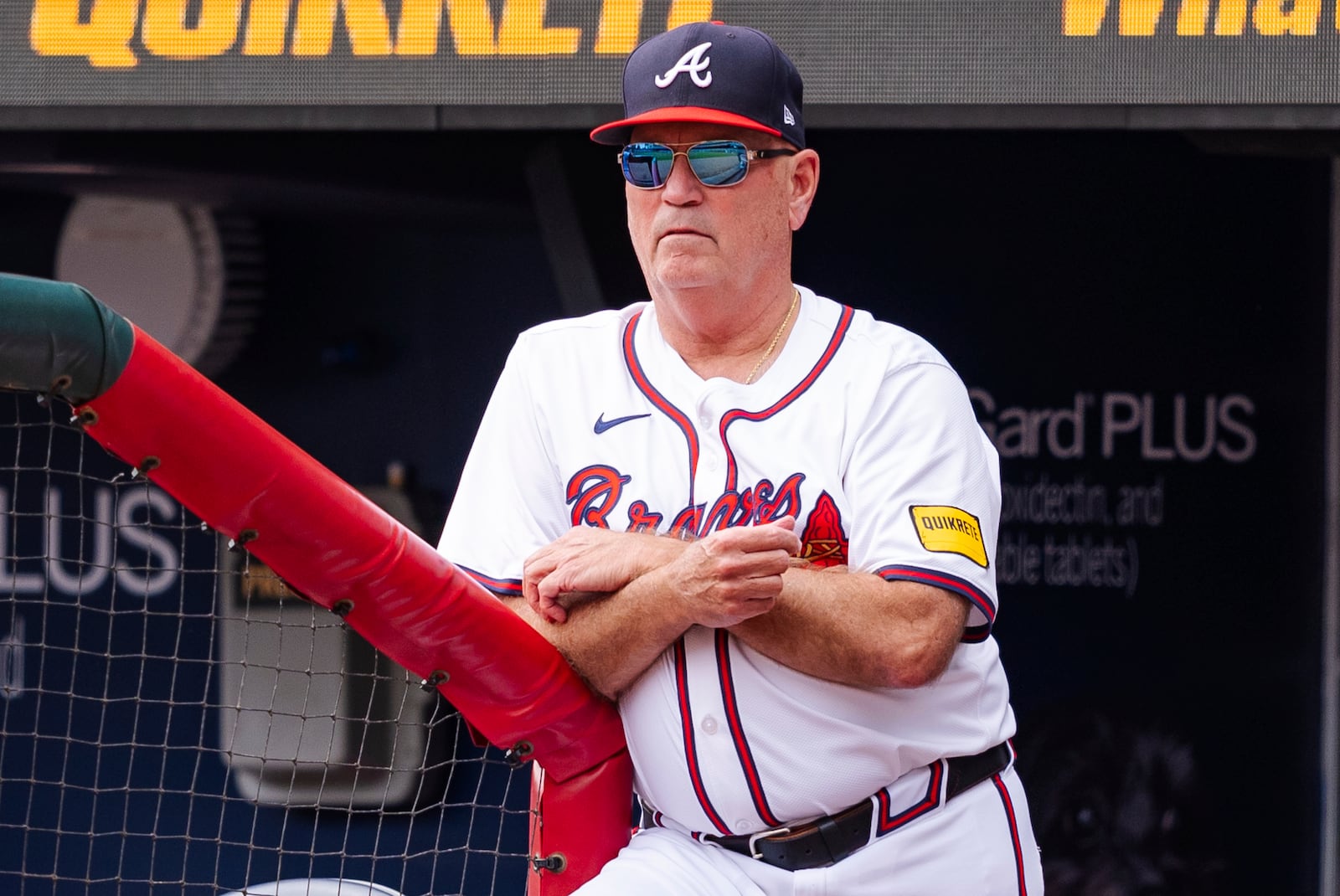 Atlanta Braves manager Brian Snitker watches from the dugout in the third inning of a baseball game against the New York Mets, Monday, Sept. 30, 2024, in Atlanta. (AP Photo/Jason Allen)