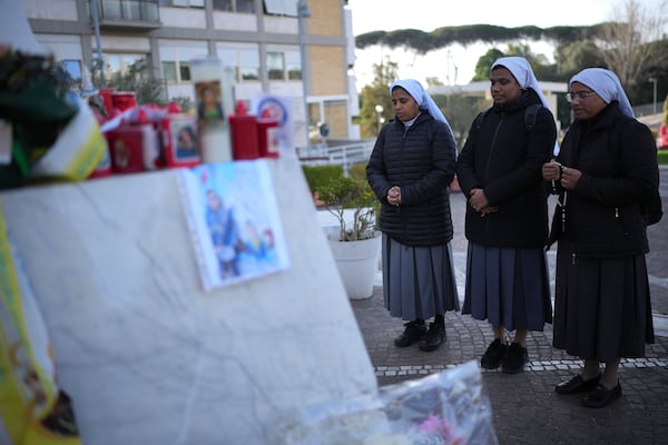 Nuns pray at the Agostino Gemelli Polyclinic, in Rome, Friday, Feb. 28, 2025 where Pope Francis has been hospitalized since Friday, Feb. 14. (AP Photo/Alessandra Tarantino)