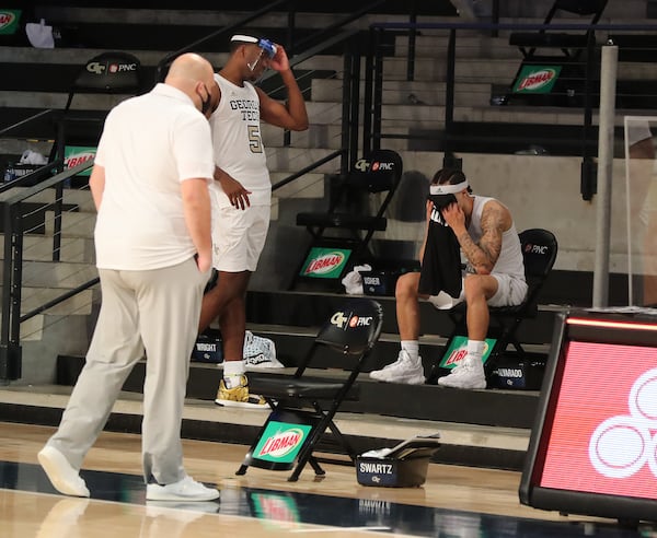 Georgia Tech guard Jose Alvarado (right) sits dejected on the bench after the game.  “Curtis Compton / Curtis.Compton@ajc.com”