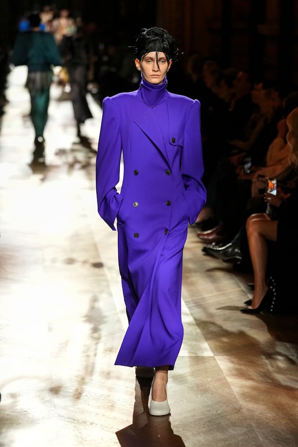 A model wears a creation as part of the Dries Van Noten Fall/Winter 2025-2026 Womenswear collection presented in Paris, Wednesday, March 5, 2025. (Photo by Scott A Garfitt/Invision/AP)