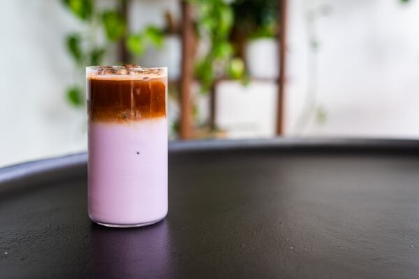 Coconut ube syrup is an easy recipe to make at home, allowing fans of Postern Coffee to make a DIY version of this colorful iced latte. The drink can also be served hot. (Henri Hollis / AJC)