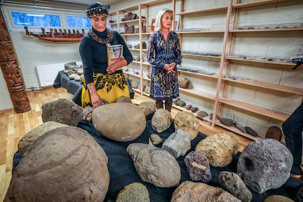 Kon-Tiki Museum's director Liv Heyerdahl, right, and Rapa Nui Chilean politician Laura Tarita Rapu Alarcon attend the "repatriation" ceremony for artifacts and human remains, at the Kon Tiki Museum in Oslo, Norway, Tuesday, Nov. 12, 2024. (Lise Åserud/NTB Scanpix via AP)