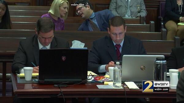 Prosecutors Chuck Boring and Jesse Evans listen as defense witness Dr. Gene Brewer answers questions about memory failure during the murder trial of Justin Ross Harris at the Glynn County Courthouse in Brunswick, Ga., on Thursday, Nov. 3, 2016. (screen capture via WSB-TV)