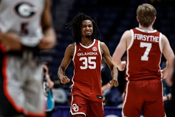 Oklahoma forward Glenn Taylor Jr. (35) celebrates a win over Georgia after the second half of an NCAA college basketball game at the Southeastern Conference tournament, Wednesday, March 12, 2025, in Nashville, Tenn. (AP Photo/Wade Payne)