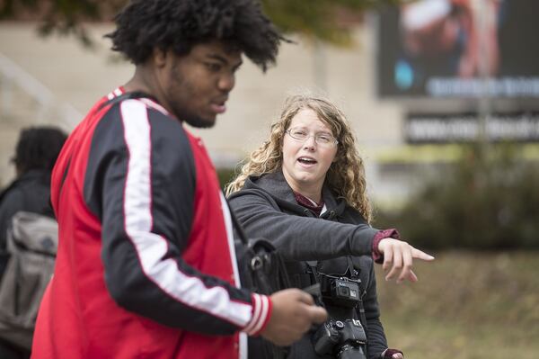 Crated Equal staff member Grace McIntosh (center), 23, speaks with Justin Strong (left) during a Created Equal event at the Georgia Institute of Technology campus in Atlanta, Monday, November 4, 2019. The Created Equal organization visited the campus with large photographs and video of aborted fetuses. Each member of the Created Equal staff had outward facing cameras on their bodies during the event. 