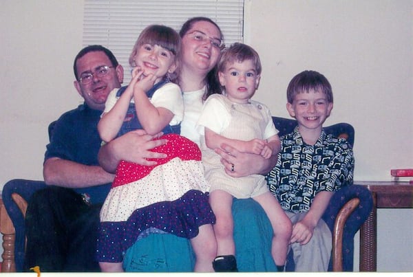 Elwyn Crocker Sr. and his wife Candice Crocker pose with the husband's kids, from left, Mary, James and JR in a 2010 photo posted publicly on the dad's Facebook page.