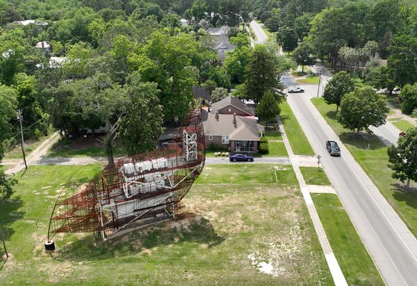 The steel framework of a giant chicken looms over the town of Fitzgerald, Wednesday, May 24, 2023. Fitzgerald - population 9,053 - set out to construct a chicken that would be the largest topiary in the world. The former mayor Jim Puckett set out to build this thing, hoping that it would attract visitors. He even had an idea that it could double as an Airbnb. But voters didn't like the idea. They voted him out in Nov. 2021 over it. But the topiary still stands. (Hyosub Shin / Hyosub.Shin@ajc.com)