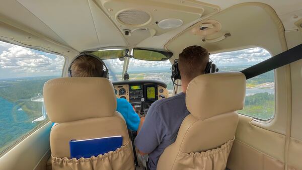 Sam Lilley in the left seat piloting a small airplane that took off from Savannah in August 2022 for a flight to reach the 1,500 flight hours required to become an airline pilot. Credit: Kaitlin Sells