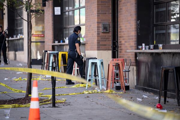 Investigators process the chaotic scene of a multiple shooting at the bar Truck Park in St. Paul, Minnesota, that happened after midnight on Sunday. 