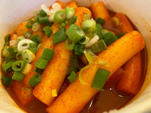 Popular Korean street food tteokbokki are chewy stir-fried rice cakes with a pronounced heat, thanks to a sauce made with gochujang (Korean red chili pepper paste) and gochugaru (Korean red chili pepper flakes). Ligaya Figueras/ligaya.figueras@ajc.com