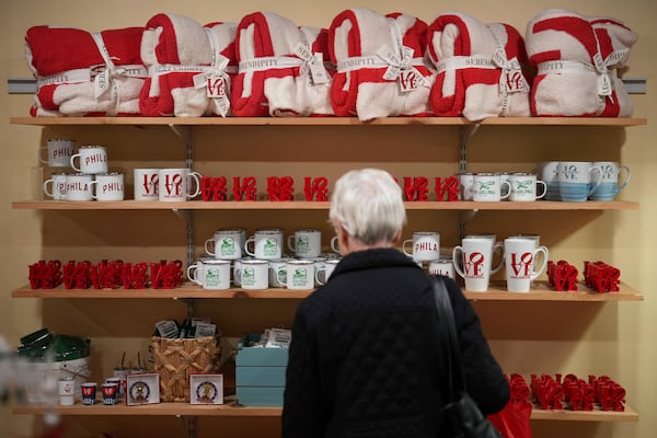 A person shops at Serendipity, Wednesday, Dec. 11, 2024, in Philadelphia. (AP Photo/Matt Slocum)