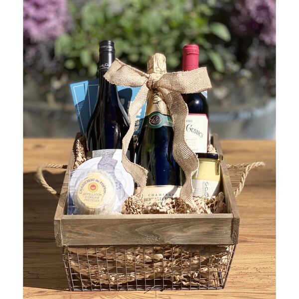 A gift basket of French cheese and wine from Perrine’s Wine Shop. is always welcomed. 
Courtesy of Perrine’s Wine Shop.