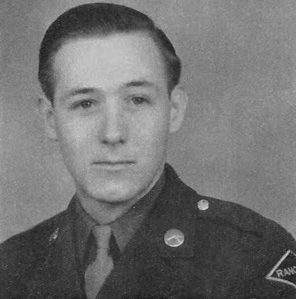 Pfc. Fred Plumlee of Columbus was just 19 when he was killed during the allied invasion of France on June 6, 1944. A D-Day reenactor group left this photo of him in August of 2019 at Normandy American Cemetery, where Plumlee is memorialized. (Courtesy)