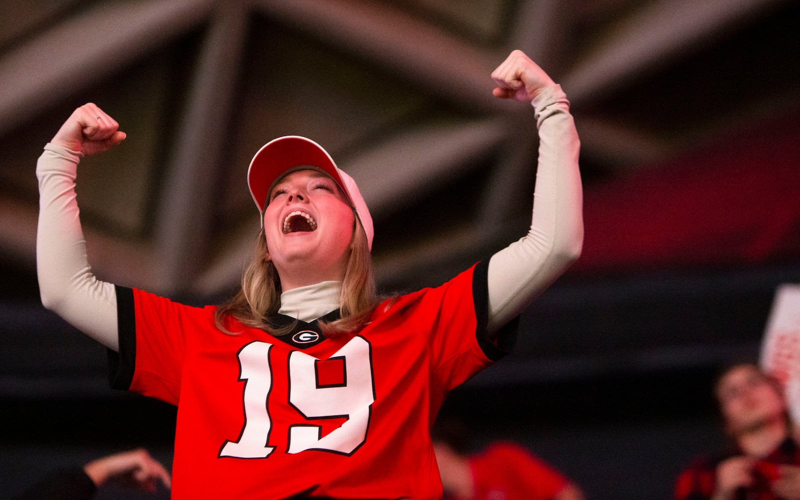 Kailey Breed celebrates during a watch party for the College Football Championship on Monday, January 9, 2023, at Stegeman Coliseum in Athens, Georgia. The University of Georgia defeated the Texas Christian University football team 65-7. CHRISTINA MATACOTTA FOR THE ATLANTA JOURNAL-CONSTITUTION.