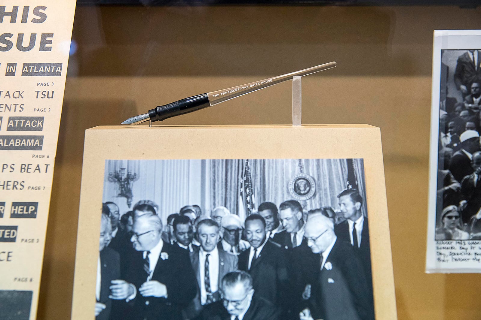 Five months after Bloody Sunday, John Lewis and Martin Luther King Jr. were guests of President Lyndon B. Johnson as he signed the 1965 Voting Rights Act into law. After the signing, Johnson gave Lewis a commemorative pen, which is now on display in a permanent art exhibit at Atlanta's Hartsfield Jackson International Airport. (Alyssa Pointer / alyssa.pointer@ajc.com)