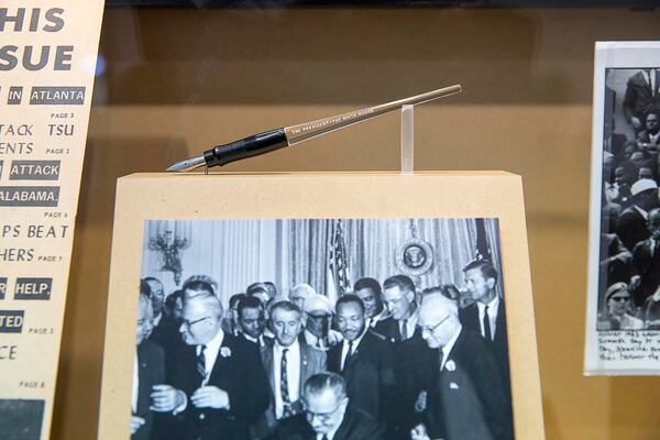 John Lewis was present at the signing of the 1965 Voting Rights Act, as commemorated in the "Good Trouble" art exhibit at Atlanta's Hartsfield-Jackson International Airport. In 2020, the bill to extend that law was renamed in Lewis' honor. (Alyssa Pointer / alyssa.pointer@ajc.com)