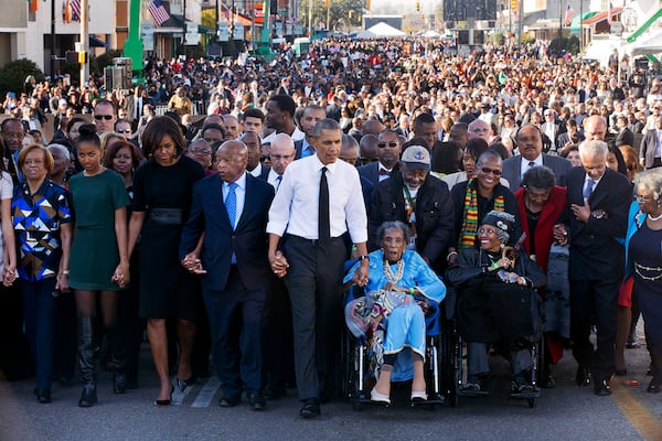 John Lewis returns every year to Selma to walk across the Edmund Pettus Bridge. In 2015, he commemorated the 50th anniversary of Bloody Sunday by joining hands with President Barack Obama and his family and leading a march. Other survivors of Bloody Sunday helped lead the procession. The event included a rare joint appearance by Obama and President George W. Bush, who also attended. (Jacquelyn Martin / AP)