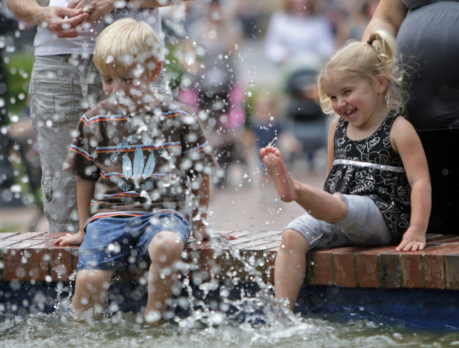 May 13, 2010: Bella Simmons splashes in the renovated fountain with Daniel Horne, both 3-year-olds from Marietta. The fountain and Marietta Square had just undergone renovations and repairs.