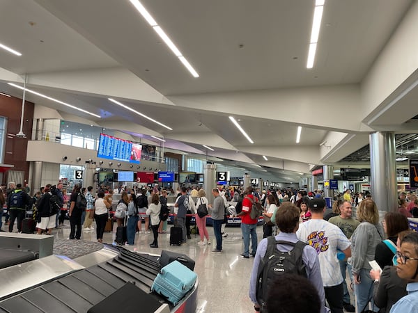 Security lines snaked through the baggage claim area at Hartsfield-Jackson International Airport on the morning of Friday, October 6, 2023.