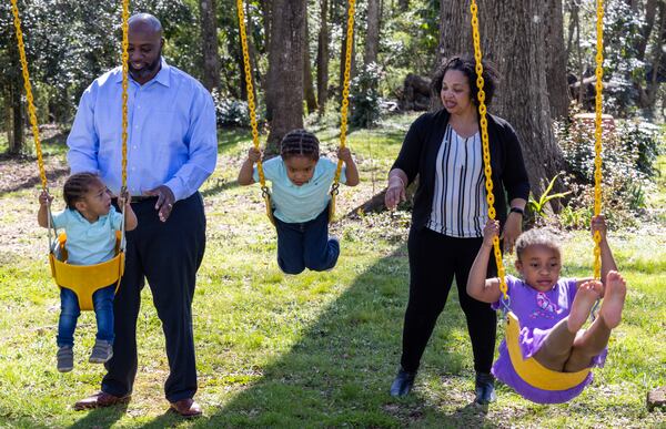 (left to right) One-year-old Isaiah Durden, his father Frederick, brother Frederick "Tre" (3), mother Tonia and sister Zoe (5) play together at their Newnan home. Dr. Frederick Durden has been surrounded by great mentors since childhood and is now taking all the influence and encouragement he received and is channeling outward. He has great humility and perspective and wants to serve others as he's been served throughout his life. Despite a busy career as a plastic surgeon, he is also a devoted husband, father of three young children, and makes times to lead cancer support groups at his church (and much more). PHIL SKINNER FOR THE ATLANTA JOURNAL-CONSTITUTION.