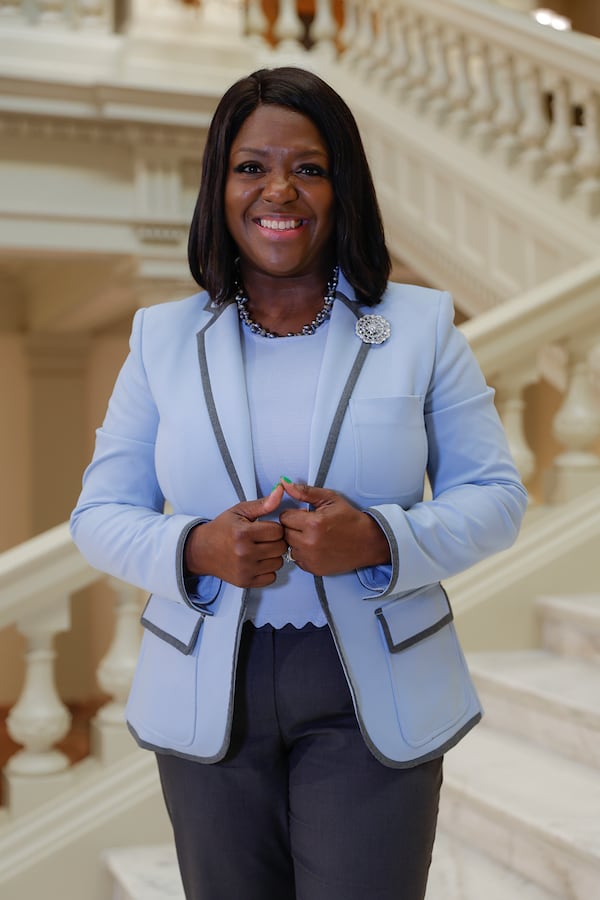 Rep. Tonya Anderson, D-Lithonia, puts a lot of thinking into what she will wear on any given day, and color plays a big role. "If it’s rainy," she said, "I usually wear bright colors to do the opposite of the mood." (Natrice Miller/ natrice.miller@ajc.com)